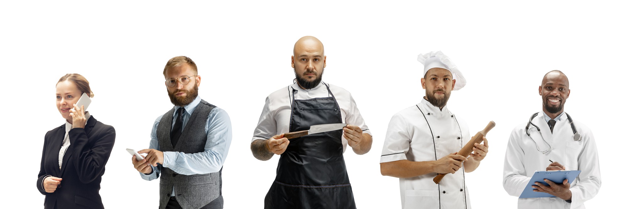 Chef consulting with restaurant staff in kitchen